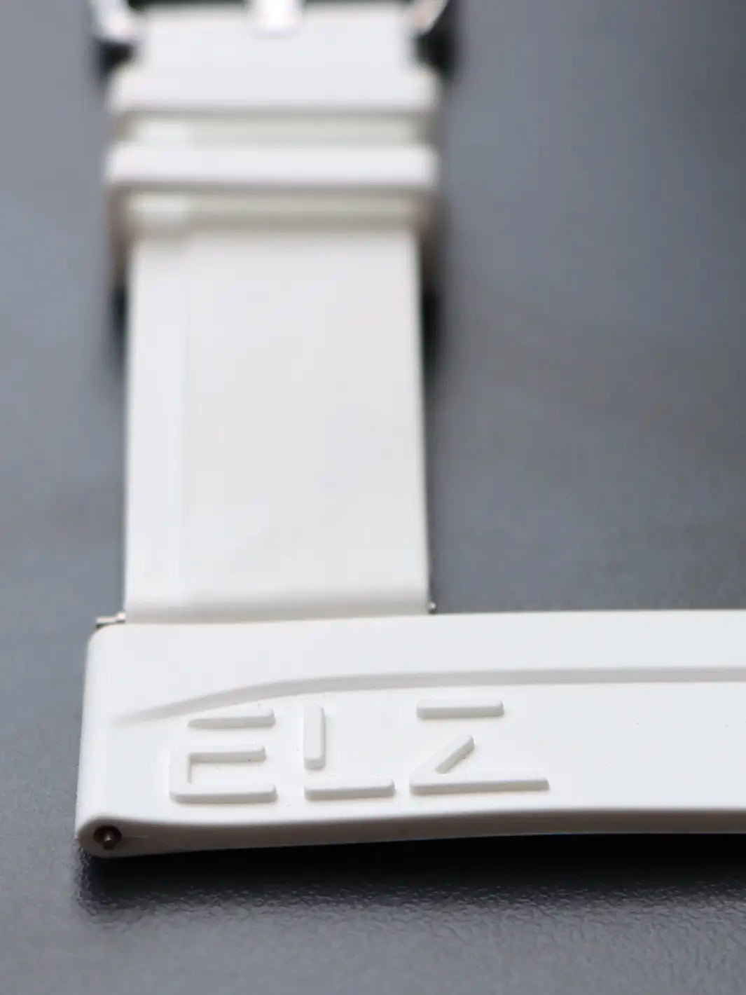 White Embossed Rubber Strap Bionic design // Silver buckle