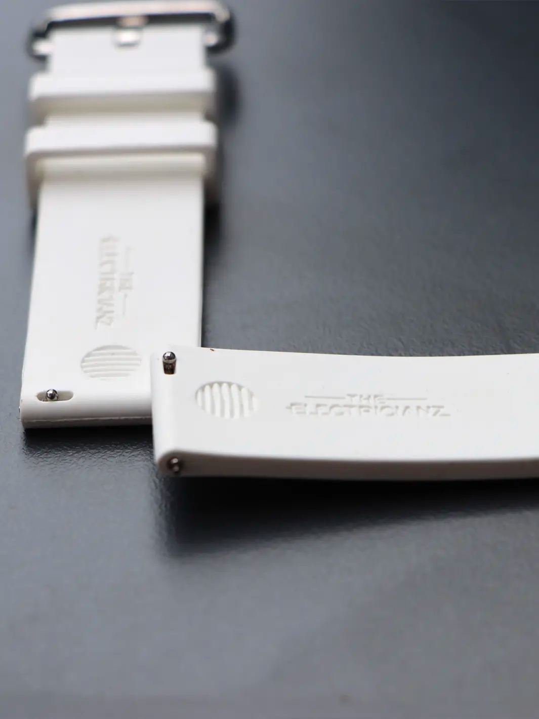White Embossed Rubber Strap Bionic design // Silver buckle